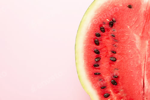 Preview: Half of fresh watermelon on pink background. Summer fruit