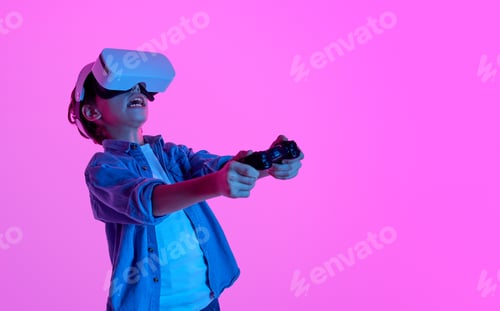 Preview: Expressive boy playing VR game in glasses
