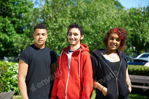 Preview: Portrait of three student friends outside college