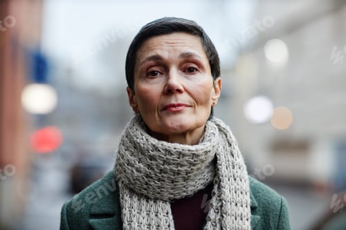 Preview: Calm Woman in Coat and Scarf Portrait