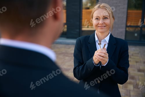 Preview: Delighted adult lady standing with keys in hands