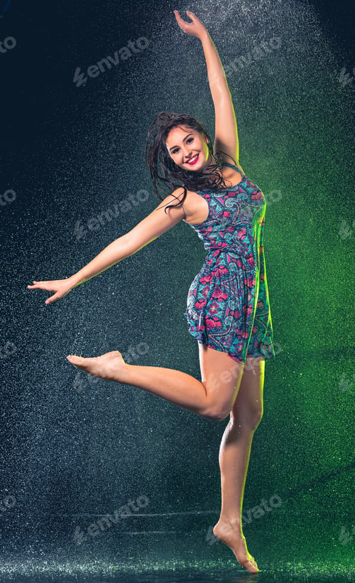 Preview: Young Beautiful Woman Under Splash Of Rain
