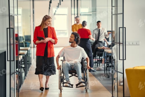 Preview: A business leader with her colleague, an African-American businessman who is a disabled person, pass
