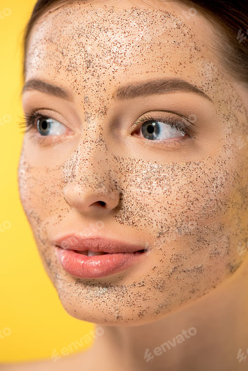 Preview: attractive woman with peeling mask, isolated on yellow