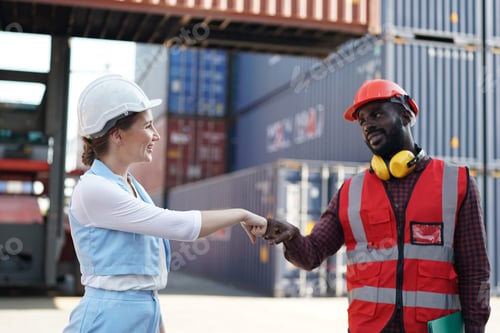 Preview: Foreman control loading Containers box from Cargo freight ship for import export.