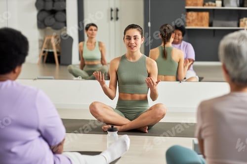 Preview: Instructor talking to people in yoga studio