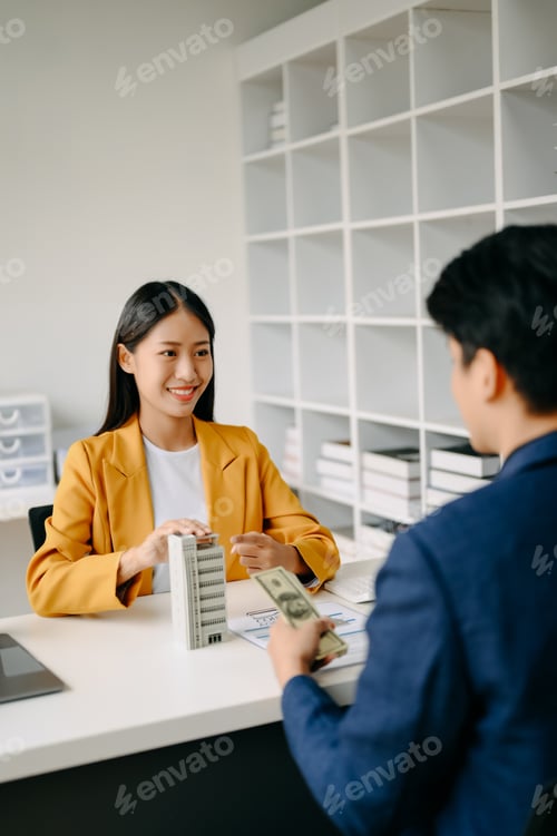 Preview: Asian Real estate broker agent presenting and consult to customer to decision making sign