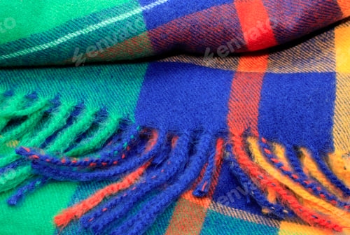 Preview: Texture of a bright multicolor scarf with fringe
