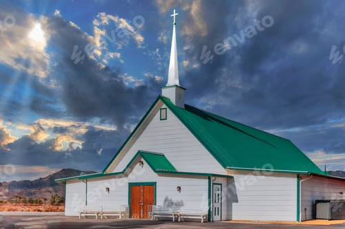Preview: an empty church sitting on the corner in the desert during a sunset