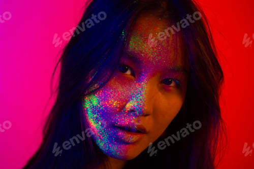Preview: Fashion model with fluo painting on the face