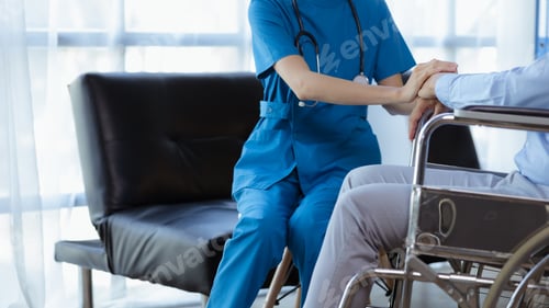 Preview: Doctor touches the arm to encourage the patient in the hospital examination room.