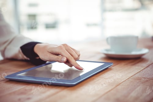 Preview: Hipster businesswoman using her tablet in office