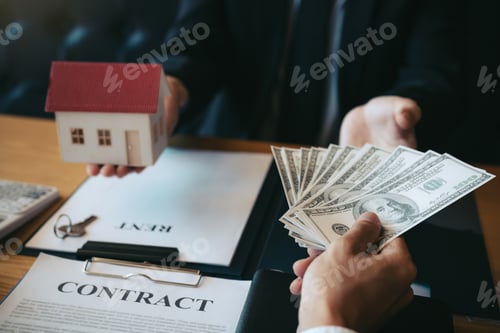 Preview: Businessman handed the money new home and real estate trading concepts.