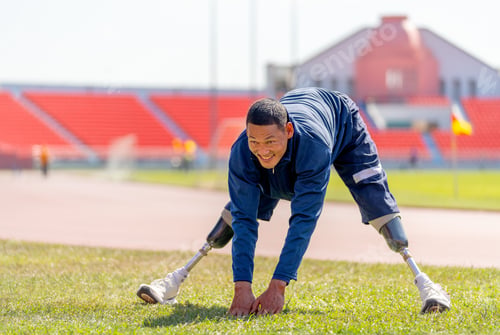 Preview: Sport man athlete with a prosthesis on his leg action of warm-up the body by spread his leg and bend