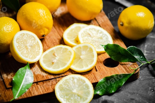 Preview: Fresh lemons. On cutting board.