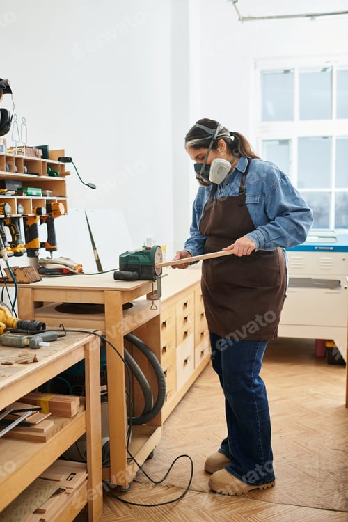 Preview: Young woman crafting in a bright workshop filled with tools and inspiration