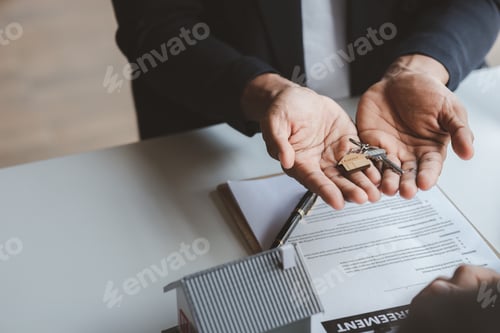 Preview: A home rental company employee is handing the house keys.