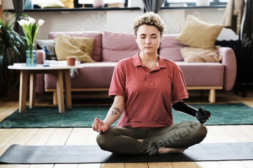 Preview: Woman with disability meditating at home