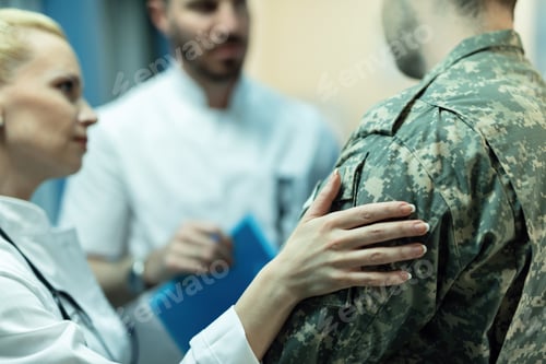 Preview: Close up of doctors consoling military officer in the hospital.
