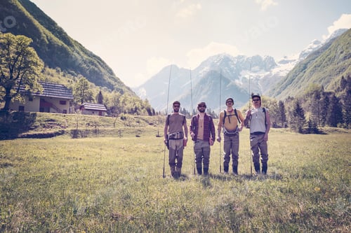 Preview: Slovenia, Bovec, four anglers standing on meadow near Soca river