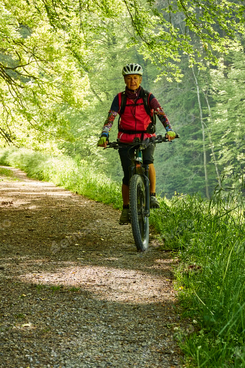 Preview: Person cycling in the Toss Valley region near Zurich, Switzerland