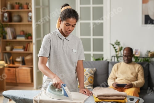Preview: Ironing Clothes in Comfortable Home Setting