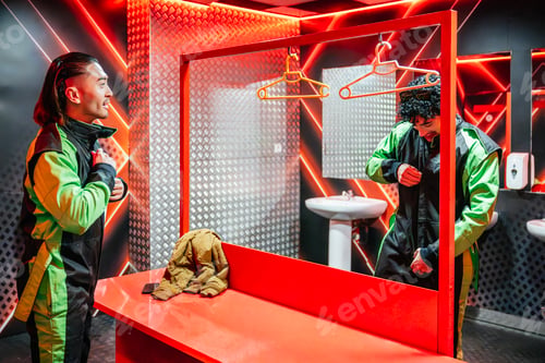 Preview: Men preparing for go kart racing fitting racing suit
