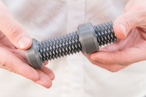 Preview: 3D printed bolt with bi-directional thread in male hands close-up