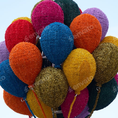 Preview: Vibrant group of multicolored balloons gathered together