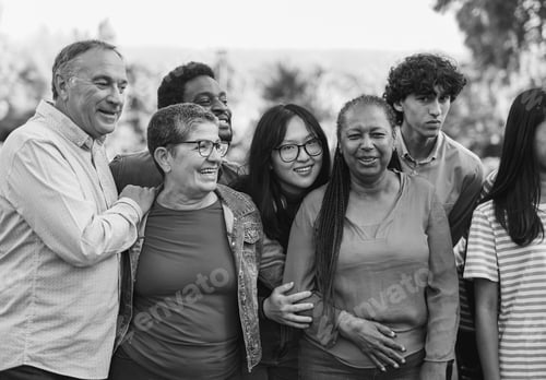 Preview: Group of multi generational people having fun together at city park