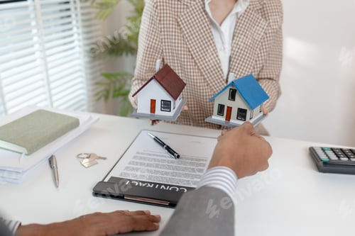 Preview: A real estate agent discusses property contracts with a client