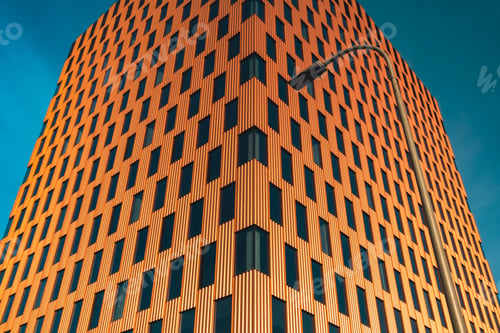 Preview: Modern office building exterior with glass facade on clear sky background. Transparent glass wall of