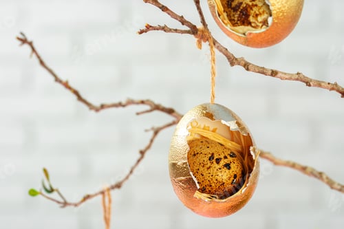 Preview: Colored Easter eggs hanging on dry branches. Easter concept