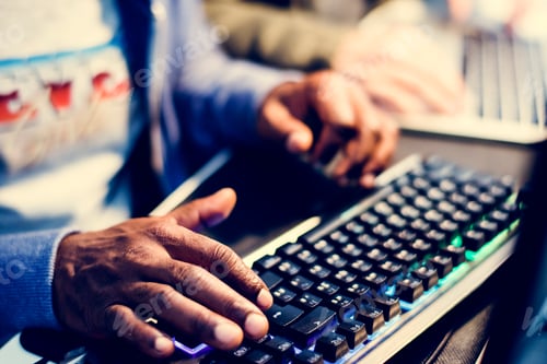 Preview: Closeup of hands working on computer keyboard