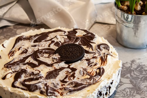 Preview: Delicious dessert cake with creamy swirls and cookie