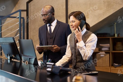 Preview: Collaborating Colleagues Working at Modern Office Desk