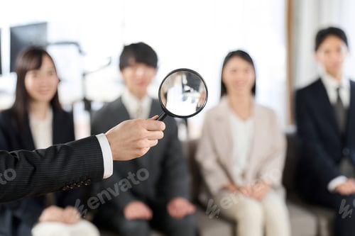 Preview: Image of searching for human resources with a magnifying glass