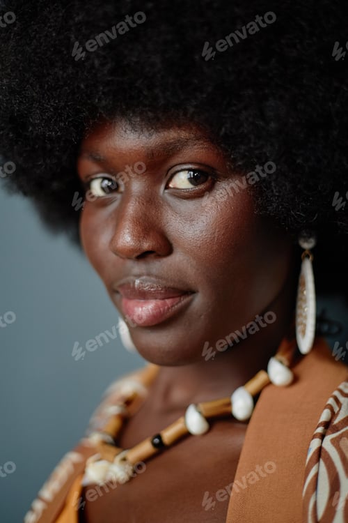 Preview: Portrait of Young Adult Black Woman Wearing Shell Necklace Celebrating Kwanzaa