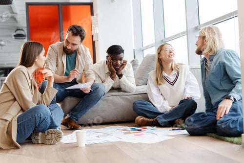 Preview: Group of young creative people brainstorming during meeting in office