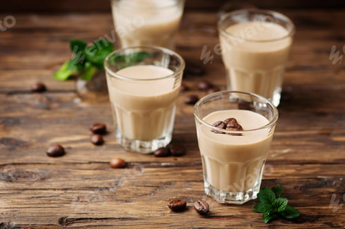 Preview: Cold cream with coffe and mint on the wooden table