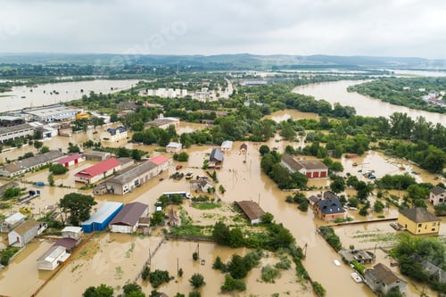 Preview: Aerial view of flooded houses with dirty water of Dnister river in Halych town, western Ukraine.