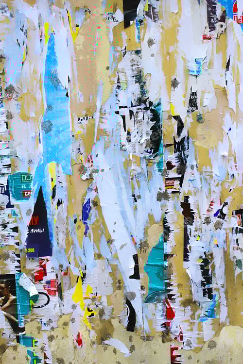 Preview: Dirty street yellow wall with old torn and peeling poster paper