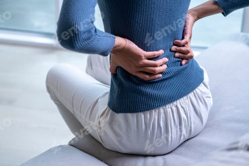 Preview: Female with back pain at home