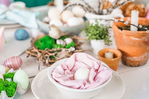 Preview: Table decoration for Easter celebration in kitchen.Tablescape for Easter holiday at home.Family reli