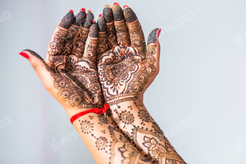 Preview: Closeup shot of female hands painted with mehndi