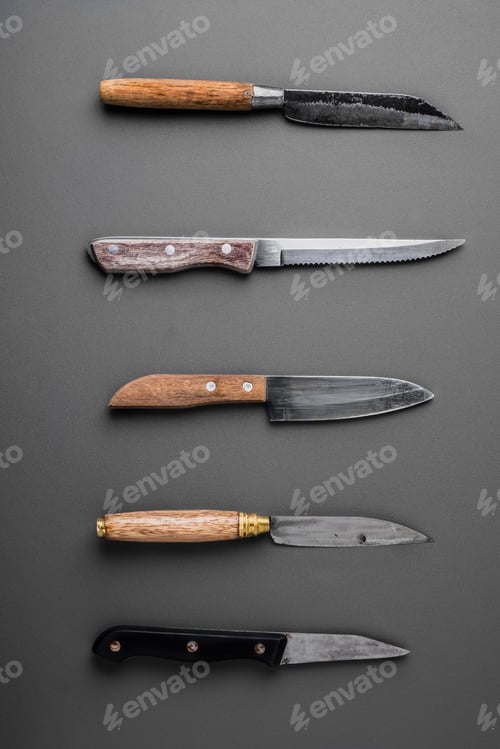 Preview: collection of various kitchen knives on a grey background