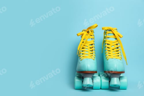Preview: Pair of stylish quad roller skates on color background. Space for text