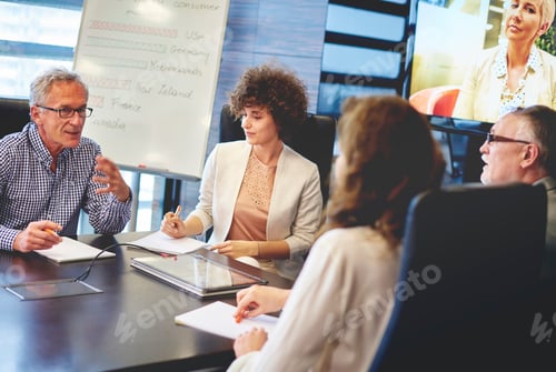 Preview: Senior business people in teleconference audience