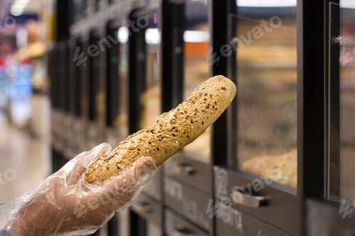 Preview: Female Hand Choosing Bread In The Market