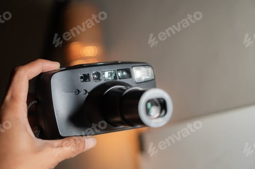 Preview: Vintage Camera in Hand with Soft Background